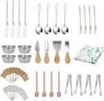 A full 68-piece charcuterie board accessories set, featuring silver cheese knives, mini tongs, spoons, and forks.