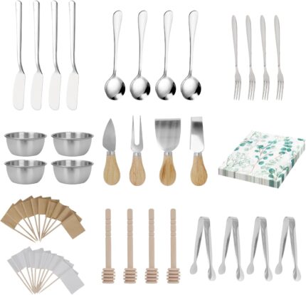 A full 68-piece charcuterie board accessories set, featuring silver cheese knives, mini tongs, spoons, and forks.