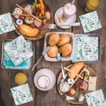 A full 68-piece charcuterie board accessories set, featuring silver cheese knives, mini tongs, spoons, and forks.