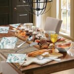 A full 68-piece charcuterie board accessories set, featuring silver cheese knives, mini tongs, spoons, and forks.
