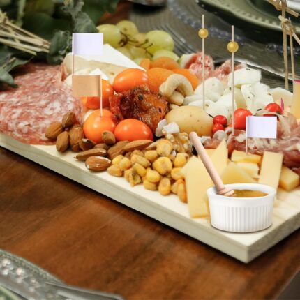 A 29-piece charcuterie board accessory set including various cheese knives, mini serving spoons, forks, tongs, and small bowl