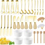 A full Mlurcu gold charcuterie utensil set, featuring various cheese knives, mini tongs, spoons, forks, and ceramic dipping b