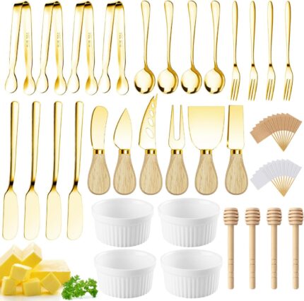 A full Mlurcu gold charcuterie utensil set, featuring various cheese knives, mini tongs, spoons, forks, and ceramic dipping b