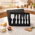 A silver 6-piece RWIXR cheese knife set neatly arranged, featuring various knives, spreaders, and a fork.