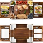Square acacia wood charcuterie board with ceramic dishes and stainless steel cheese knives, ready for serving.
